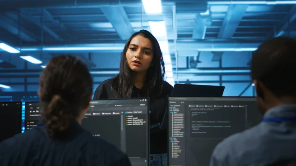 Is the CompTIA CySA+ Certification Worth It Today? 4 manager coordinating tech specialists fixing data center damages