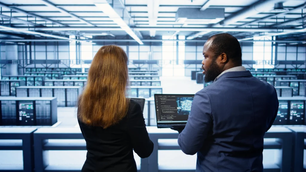 Is the Fortinet Certified Fundamentals in TrainingCoursesNow (FCF) Worth It Today? 2 teamworking programmers data center overseeing server operations